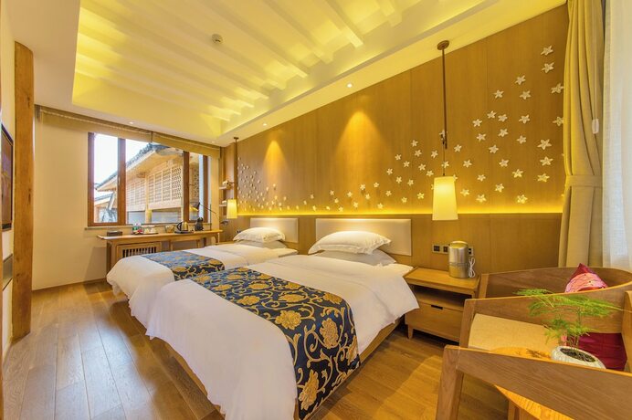 Imagen de la habitación del Hotel Lijiang Flavor Holiday Courtyard. Foto 14