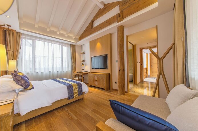 Imagen de la habitación del Hotel Lijiang Flavor Holiday Courtyard. Foto 15