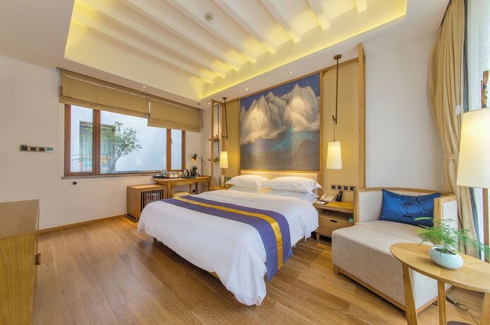 Imagen de la habitación del Hotel Lijiang Flavor Holiday Courtyard. Foto 16