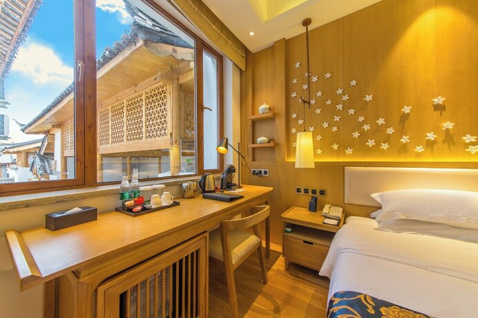 Imagen de la habitación del Hotel Lijiang Flavor Holiday Courtyard. Foto 18