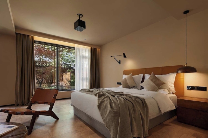 Imagen de la habitación del Hotel Lijiang Garden vacation PuZhi hotel. Foto 6