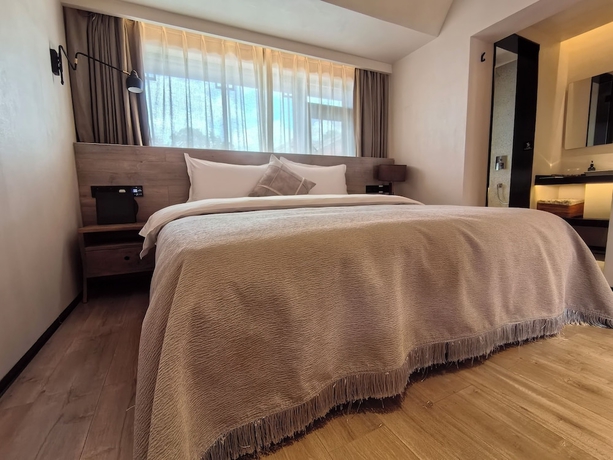 Imagen de la habitación del Hotel Lijiang Garden vacation PuZhi hotel. Foto 10