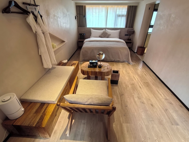 Imagen de la habitación del Hotel Lijiang Garden vacation PuZhi hotel. Foto 11
