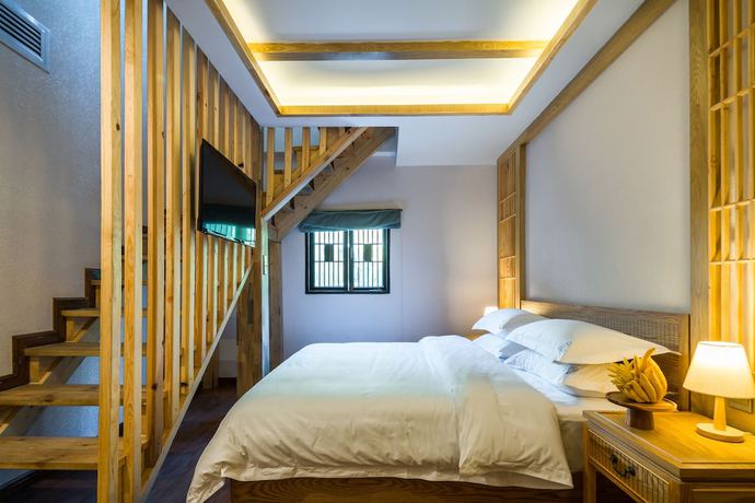 Imagen de la habitación del Hotel Lijiang Gemmer Hotel. Foto 12