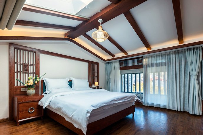Imagen de la habitación del Hotel Lijiang Gemmer Hotel. Foto 13