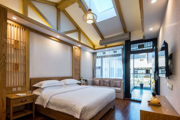 Imagen de la habitación del Hotel Lijiang Gemmer Hotel. Foto 18