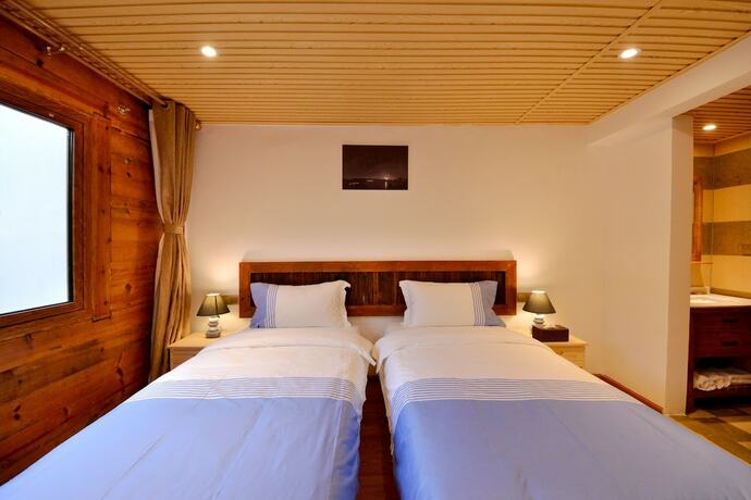 Imagen de la habitación del Hotel Lijiang Guanlanyue Inn. Foto 19