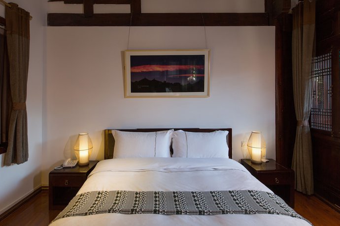 Imagen de la habitación del Hotel Lijiang Junpoxuan. Foto 3
