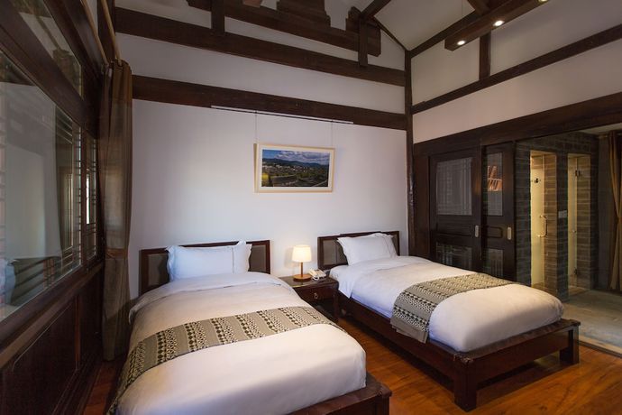 Imagen de la habitación del Hotel Lijiang Junpoxuan. Foto 7