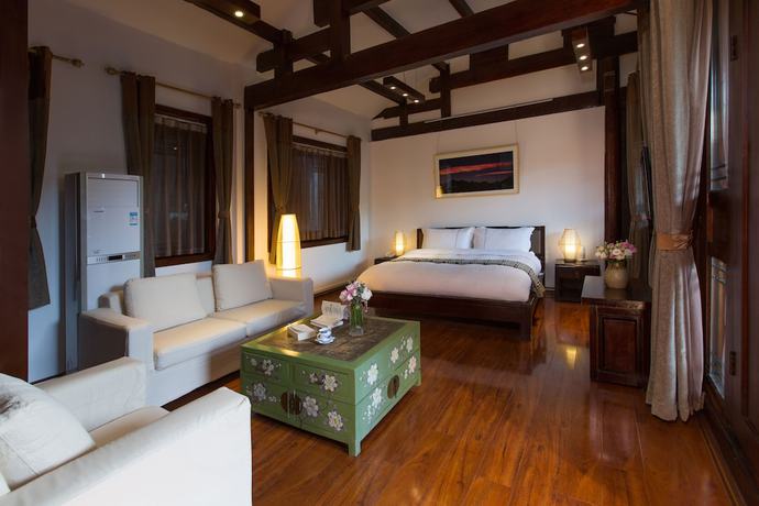 Imagen de la habitación del Hotel Lijiang Junpoxuan. Foto 8