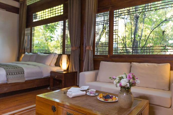 Imagen de la habitación del Hotel Lijiang Junpoxuan. Foto 12