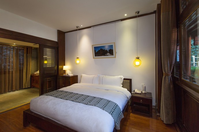 Imagen de la habitación del Hotel Lijiang Junpoxuan. Foto 13