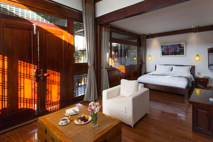 Imagen de la habitación del Hotel Lijiang Junpoxuan. Foto 15
