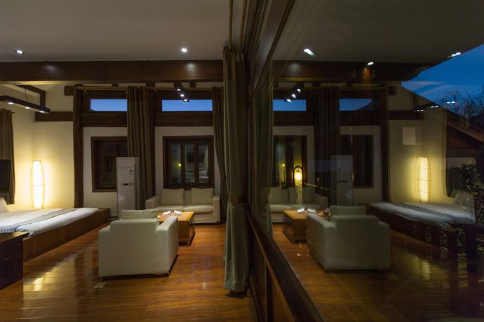 Imagen de la habitación del Hotel Lijiang Junpoxuan. Foto 16