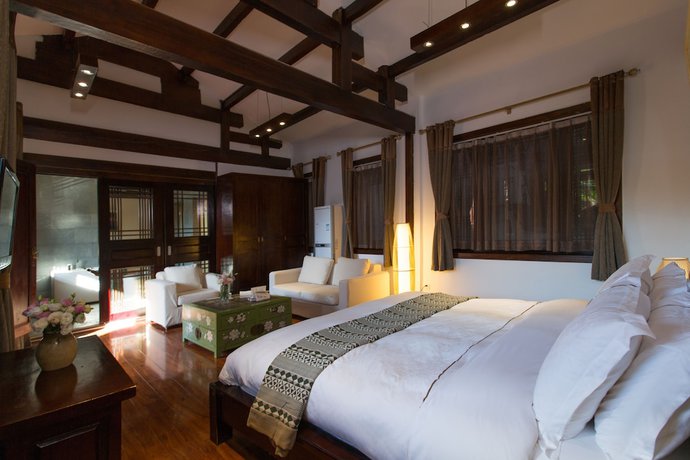 Imagen de la habitación del Hotel Lijiang Junpoxuan. Foto 17