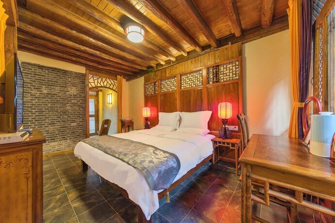 Imagen de la habitación del Hotel Lijiang Langyun Inn. Foto 11