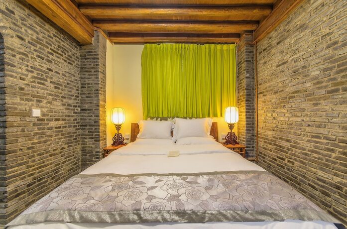 Imagen de la habitación del Hotel Lijiang Langyun Inn. Foto 17