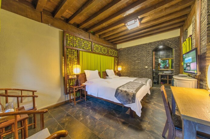 Imagen de la habitación del Hotel Lijiang Langyun Inn. Foto 18