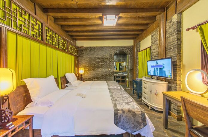 Imagen de la habitación del Hotel Lijiang Langyun Inn. Foto 20