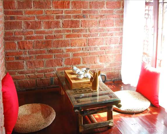 Imagen de la habitación del Hotel Lijiang Lazy Tiger Inn. Foto 17
