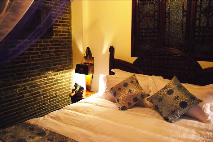 Imagen de la habitación del Hotel Lijiang Lazy Tiger Inn. Foto 18