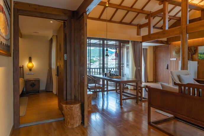 Imagen de la habitación del Hotel Lijiang Passing-cloud Resort. Foto 21
