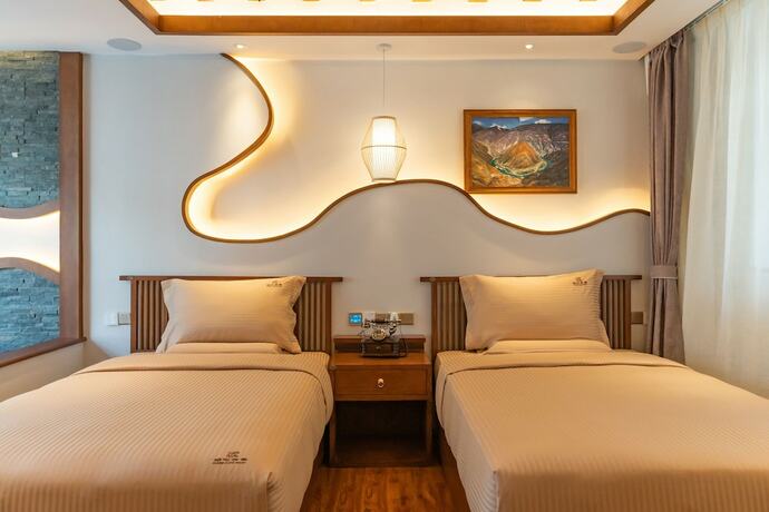 Imagen de la habitación del Hotel Lijiang Passing-cloud Resort. Foto 22