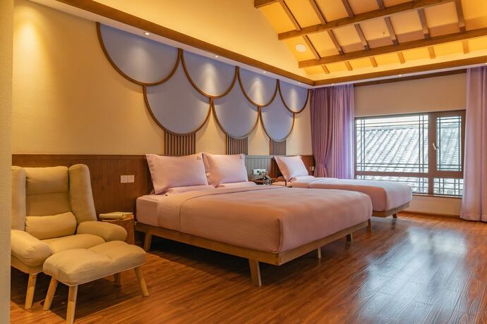 Imagen de la habitación del Hotel Lijiang Passing-cloud Resort. Foto 23