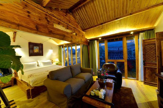 Imagen de la habitación del Hotel Lijiang Seven Island Resort. Foto 5
