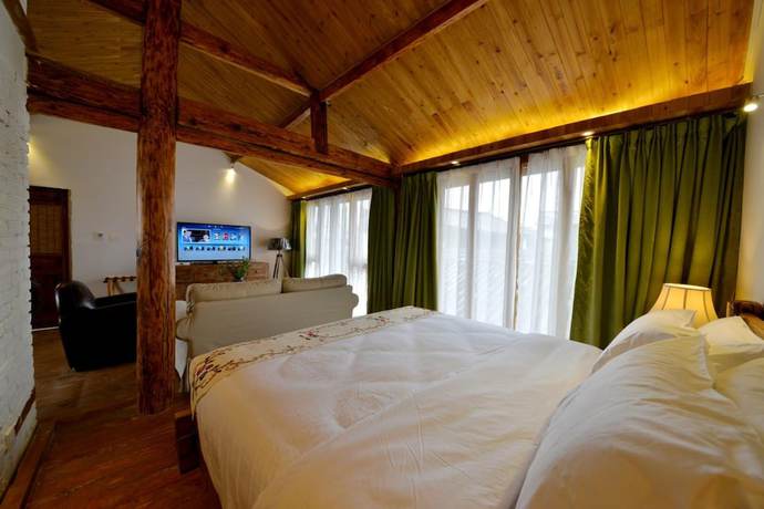 Imagen de la habitación del Hotel Lijiang Seven Island Resort. Foto 7