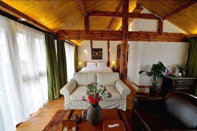 Imagen de la habitación del Hotel Lijiang Seven Island Resort. Foto 10