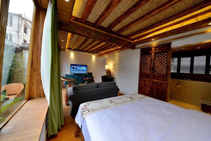Imagen de la habitación del Hotel Lijiang Seven Island Resort. Foto 11
