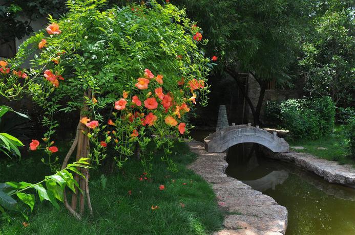 Imagen de los exteriores del Hotel Lijiang Shuhe Youyiju Private Club. Foto 15