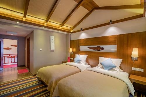 Imagen de la habitación del Hotel Lijiang Sunshine Nali Inn. Foto 6