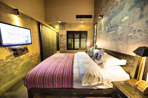 Imagen de la habitación del Hotel Lijiang Ten Courtyard Inn. Foto 2
