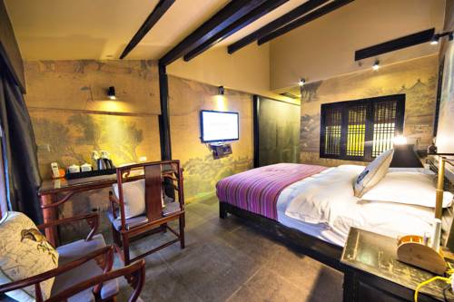 Imagen de la habitación del Hotel Lijiang Ten Courtyard Inn. Foto 3