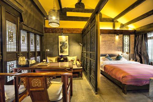 Imagen de la habitación del Hotel Lijiang Ten Courtyard Inn. Foto 4