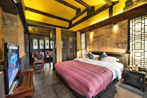 Imagen de la habitación del Hotel Lijiang Ten Courtyard Inn. Foto 5