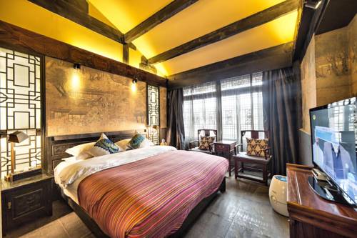Imagen de la habitación del Hotel Lijiang Ten Courtyard Inn. Foto 6