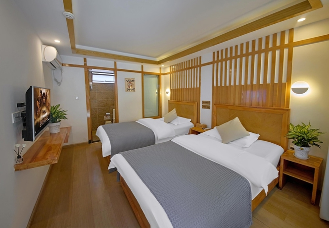 Imagen de la habitación del Hotel Lijiang Tongfu Inn. Foto 4