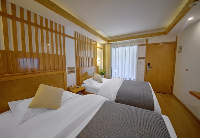 Imagen de la habitación del Hotel Lijiang Tongfu Inn. Foto 7