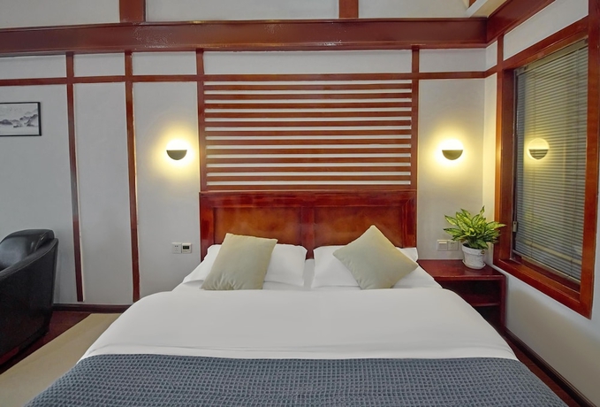 Imagen de la habitación del Hotel Lijiang Tongfu Inn. Foto 9