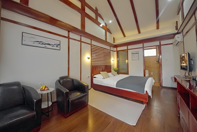 Imagen de la habitación del Hotel Lijiang Tongfu Inn. Foto 10