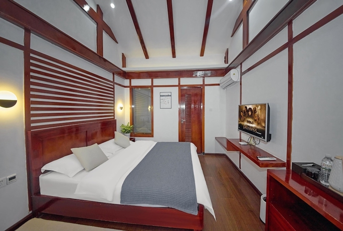 Imagen de la habitación del Hotel Lijiang Tongfu Inn. Foto 11