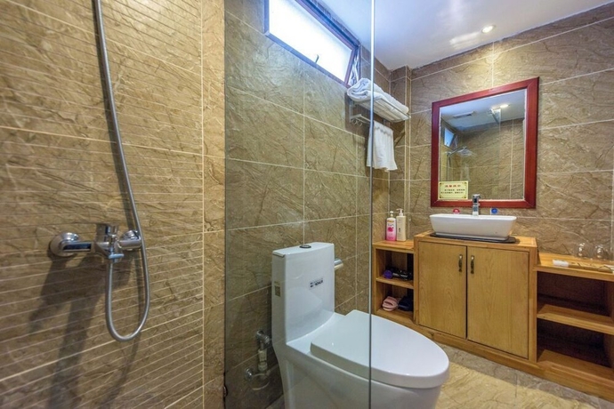 Imagen de la habitación del Hotel Lijiang Tongfu Inn. Foto 12