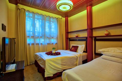 Imagen de la habitación del Hotel Lijiang Wangfu. Foto 4
