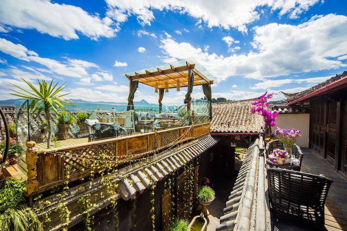 Imagen de la habitación del Hotel Lijiang Wengjia Dayuan. Foto 4