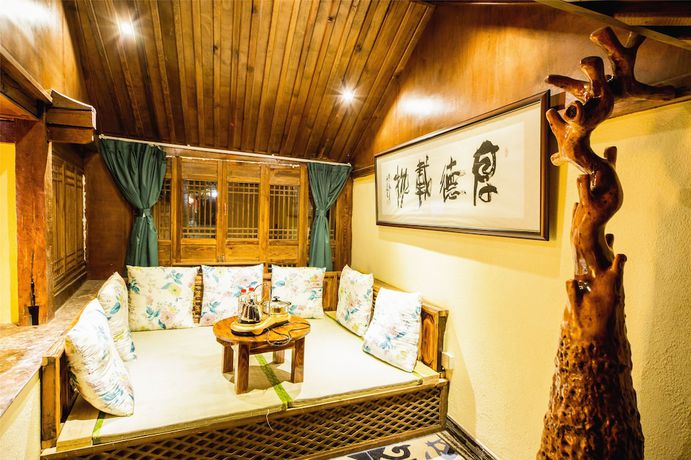 Imagen de la habitación del Hotel Lijiang Wengjia Dayuan. Foto 7
