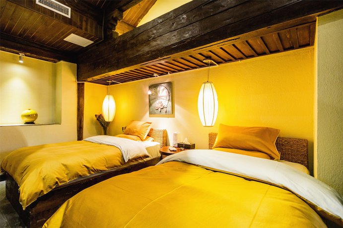 Imagen de la habitación del Hotel Lijiang Wengjia Dayuan. Foto 17