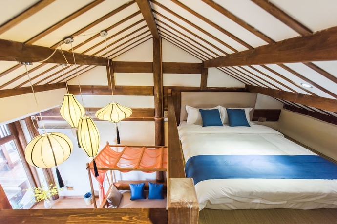 Imagen de la habitación del Hotel Lijiang Yue Tu Inn. Foto 2